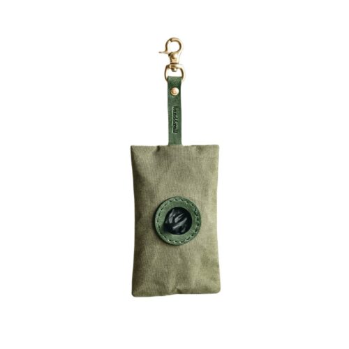 Front view of stylish and durable waste bag dispenser in Green by Band & Roll, made with lightweight and water-repellent waxed cotton. Handcrafted with solid brass hardware and full-grain vegetable-tanned leather.