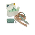 A set of elegant and durable dog walk accessories made of vegan leather, including a poop bag holder and a leash. The bright and subtle two-tone coloring, complemented by nickel-free matte silver hardware, adds a pop of color to your daily dog walks. The leash is sturdy and strong, while the poop bag holder is designed to match the leash and can be easily attached to it or carried separately.