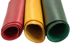Multiple rolls of leather sheets in various colors